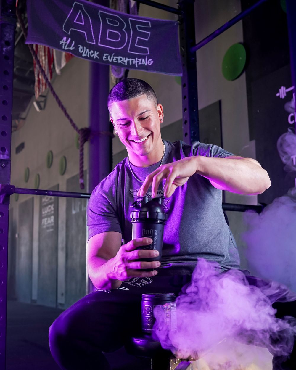 Luke Elsman training with ABE supplements in a high-energy gym setting, showcasing strength, fitness motivation and performance branding.