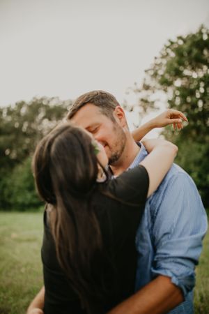 Romantic outdoor portrait session showing intimate moments between a couple.