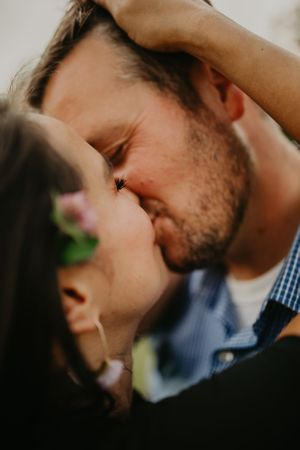Close-up intimate portrait of a couple sharing a tender moment.
