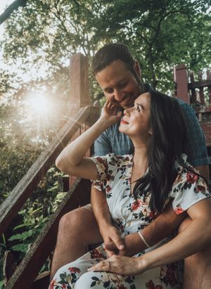 Intimate candid moments captured between couple relaxing outdoors.