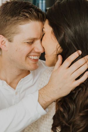 Close-up portraits capture tender moments between a couple in white.