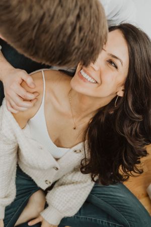 Close-up shots capture joyful, candid moments between a couple.