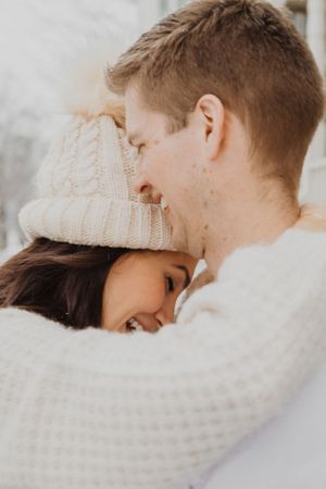Intimate close-up portraits of a couple sharing tender winter moments together.