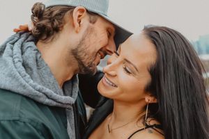 A romantic couple shares intimate close-up moments in a series of candid outdoor photos.