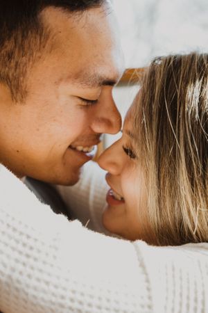 Close up series of a couple sharing an intimate moment in natural lighting.