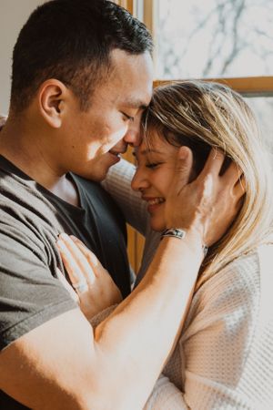 Intimate sequence of a couple sharing tender moments together indoors.