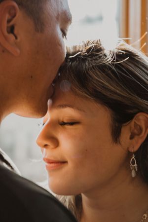 Close up profile shots showing tender romantic moments between a couple.