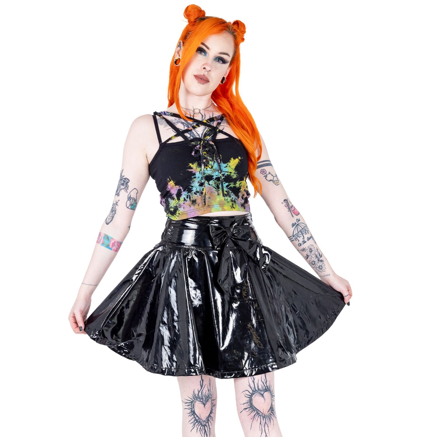 Alternative emo styled tattooed femme model with orange hair for small fashion brand in a photography studio in Hove