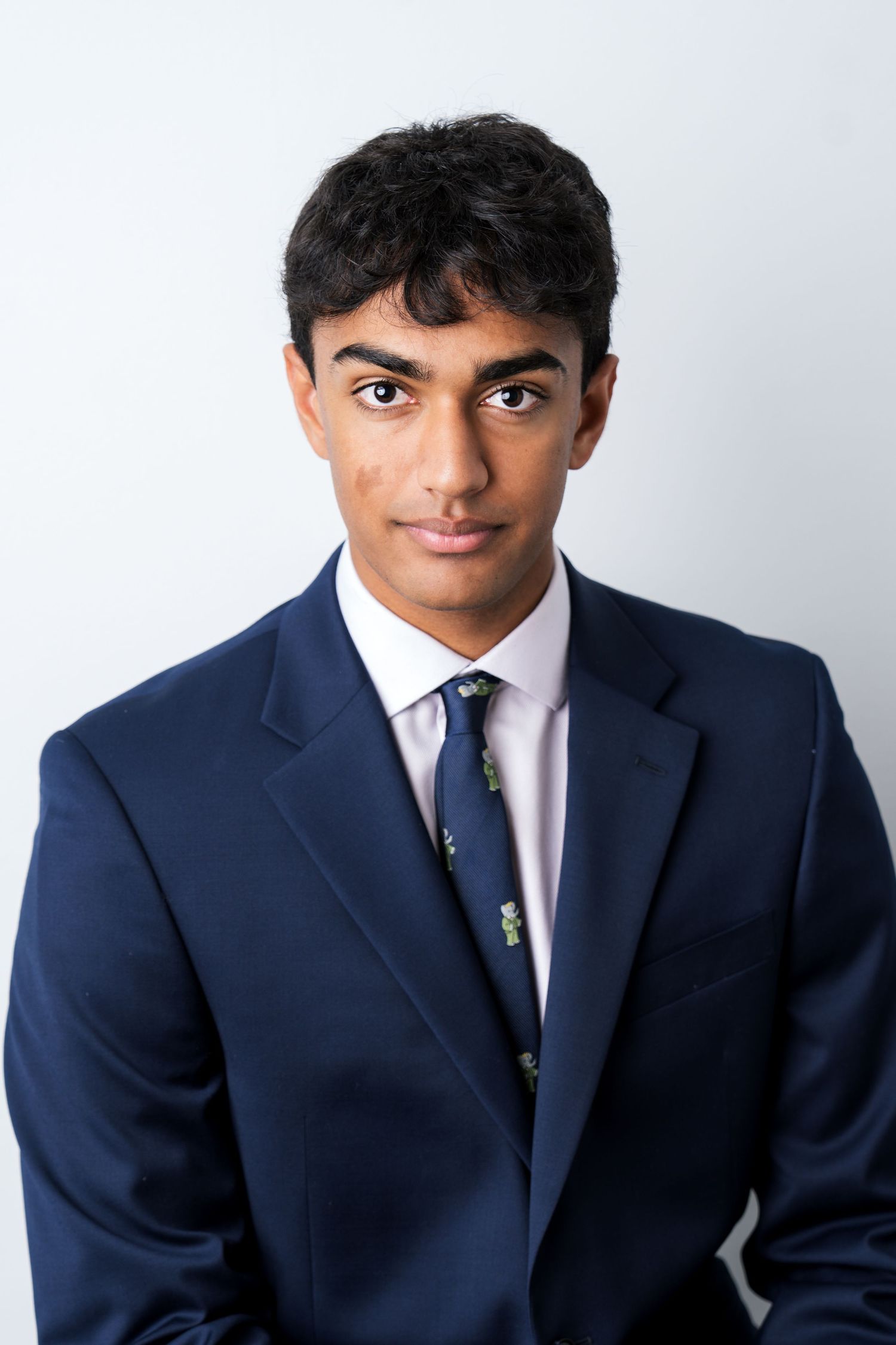 Close-up headshot of a businessman in black suit - shot by Milwaukee headshot photographer Rachel Dickman.