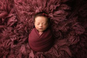 Tiny newborn girl wrapped in mauve. - Greenville SC newborn photographer - Easley SC newborn photographer