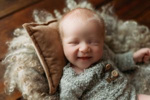 Newborn boy with a huge smile on his face. - Greenville SC newborn photographer - Easley SC newborn photographer