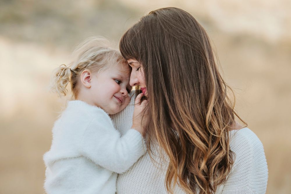 Sweet mother and daugher share cuddles