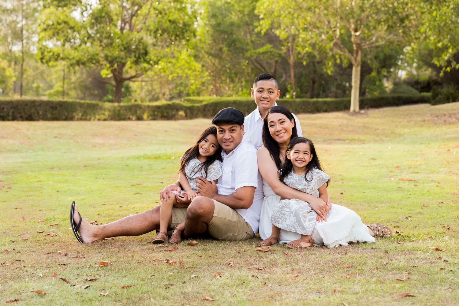 family of five outdoor portrait on the grass lake eden
