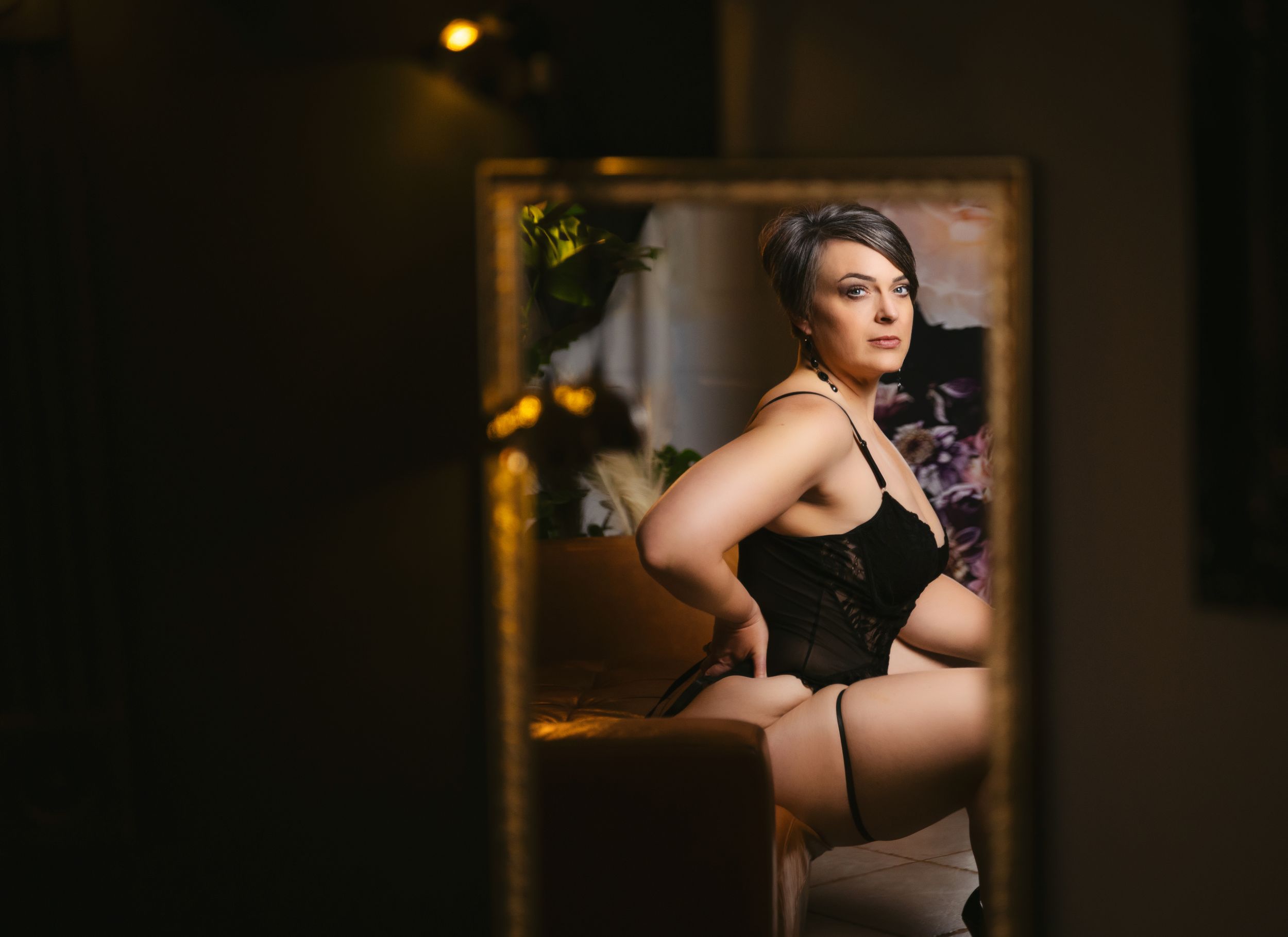 Beautiful woman looking at herself in the mirror. Greenville SC Boudoir, Easley SC Boudoir, Upstate SC boudoir