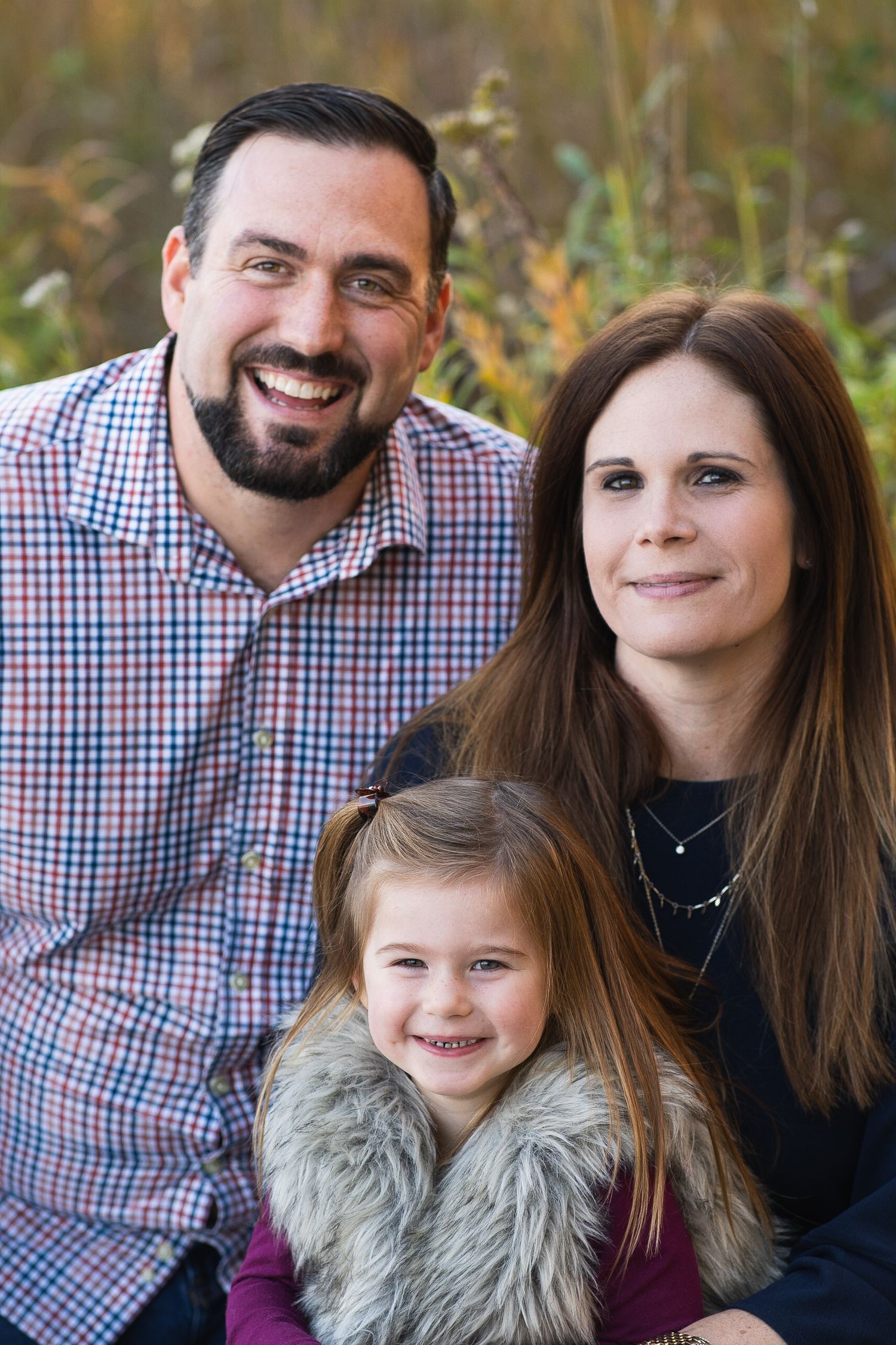 Family portrait of young girl with parents
