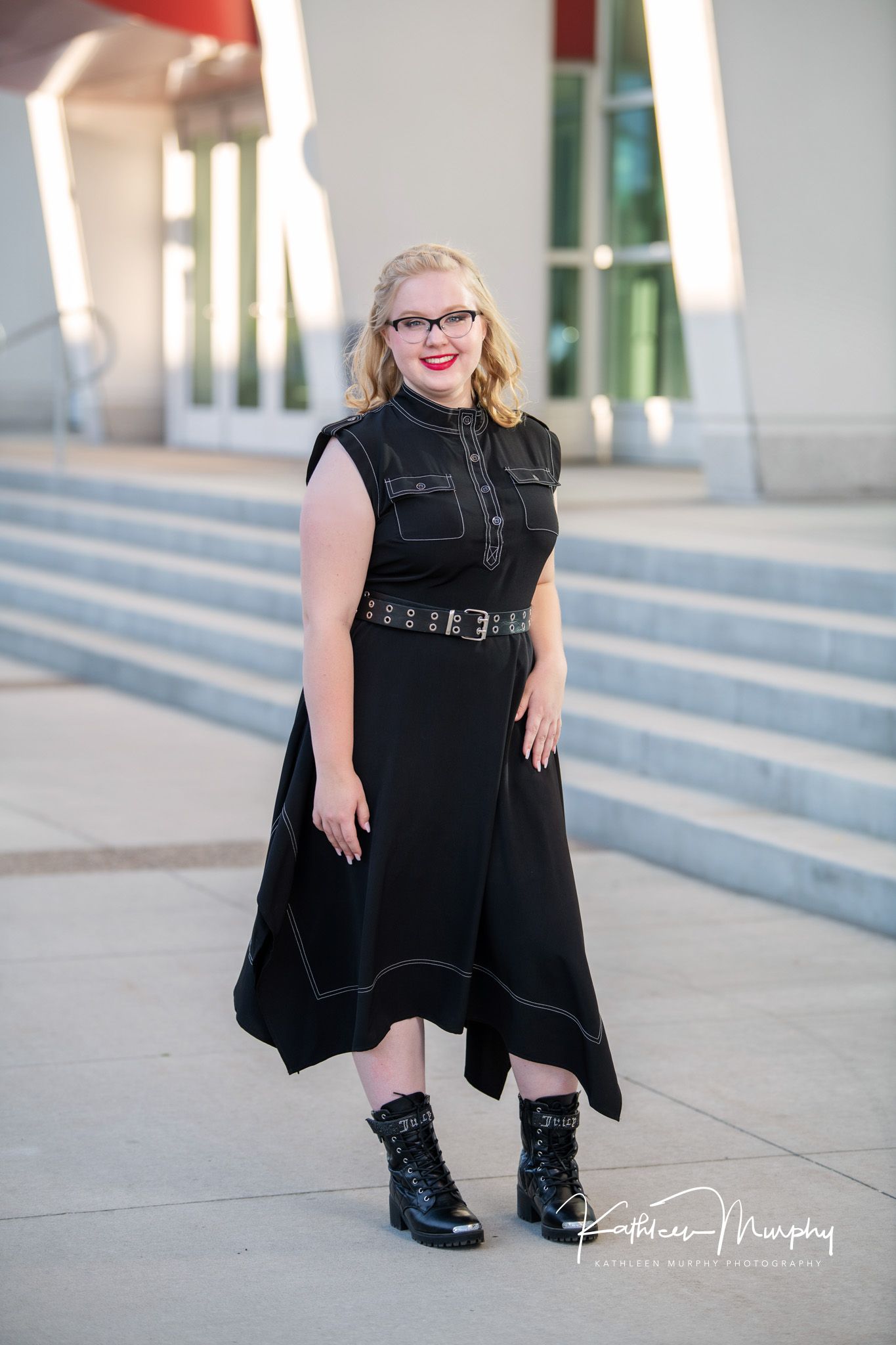 Kathleen Murphy Photography picture of a girl in a black dress in an urban setting