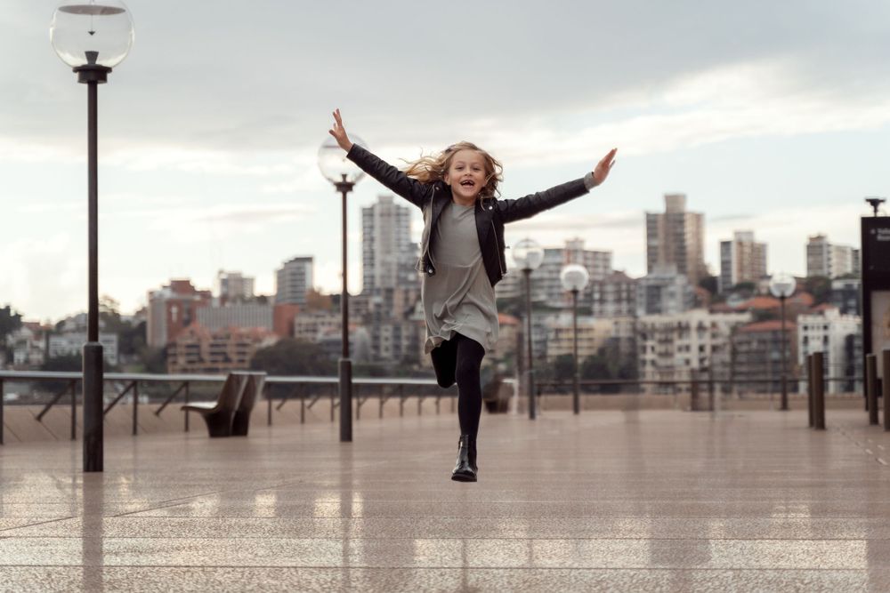 girl having fun at Sydney city centre family photoshoot