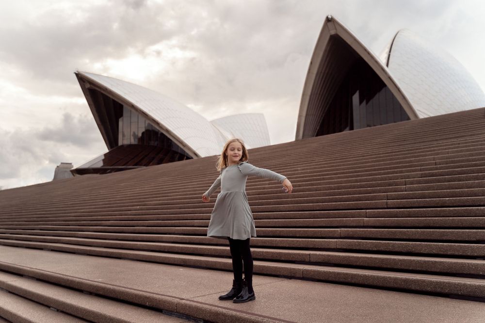 girl in front of the Sydney Opera house during a family photoshoot