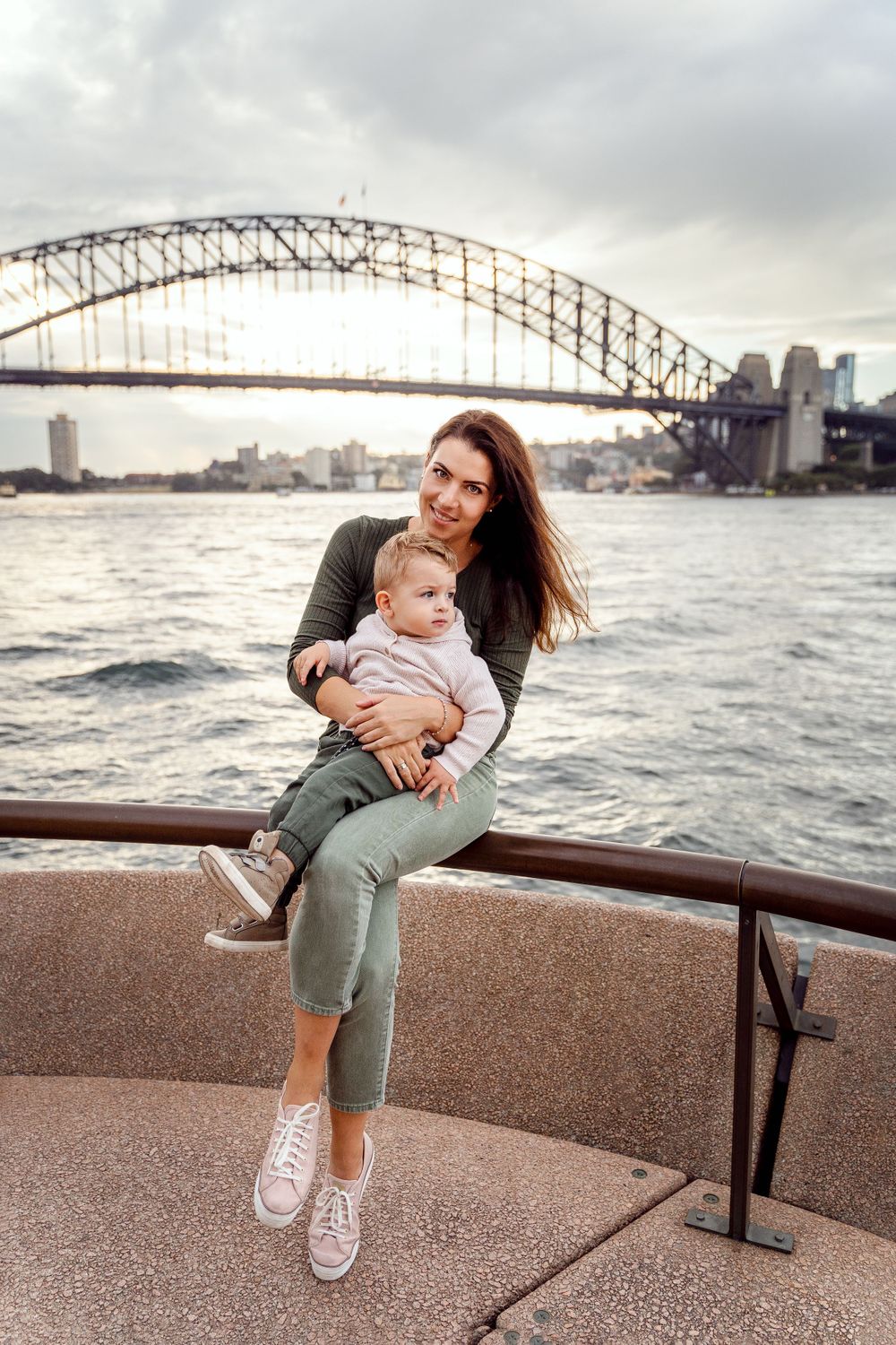 son and mother during a family photoshoot in front of the harbour bridge