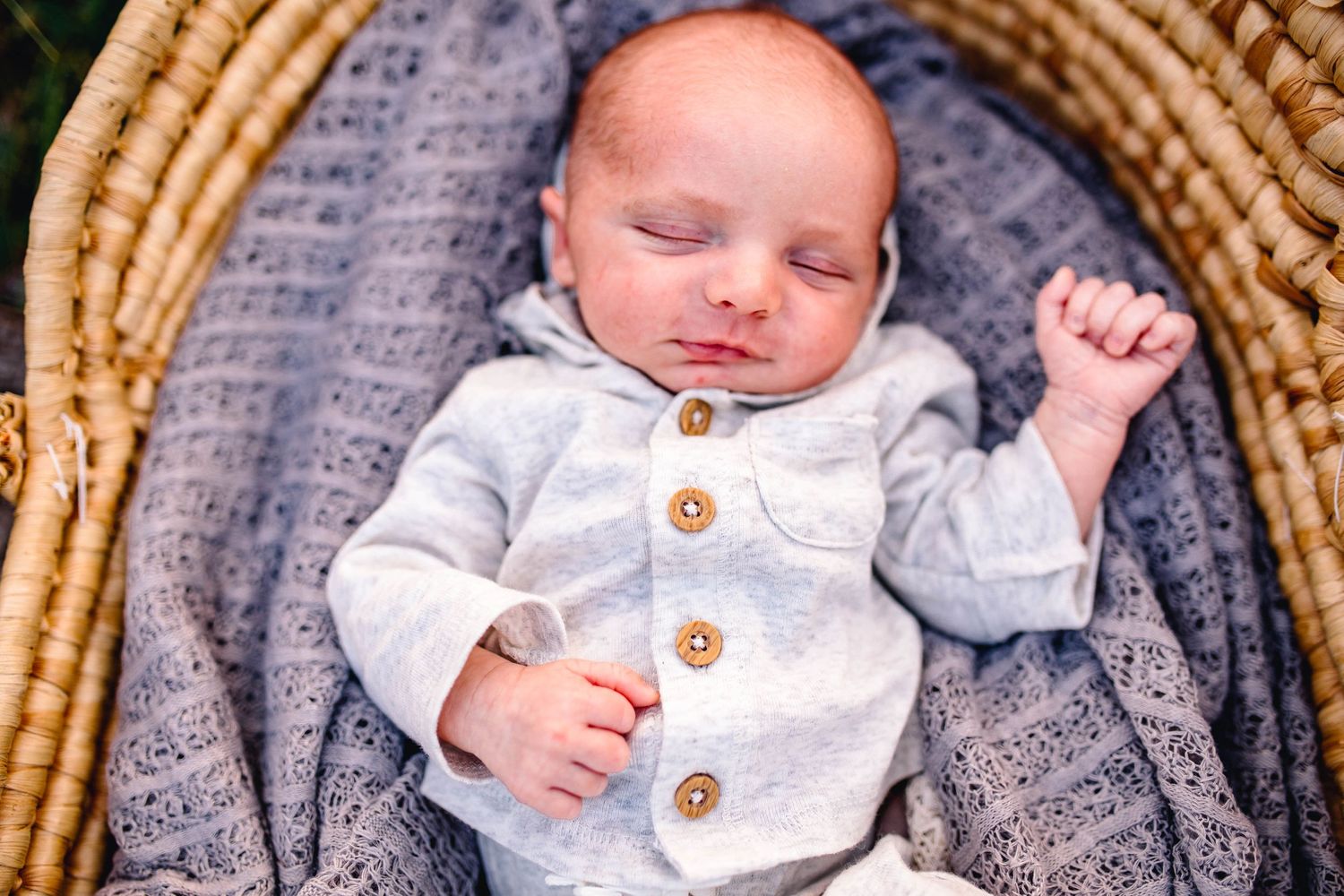 baby boy in tad pole bassinet