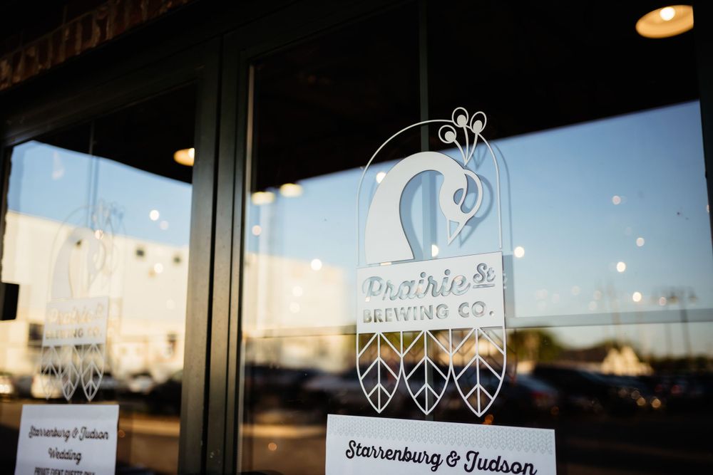 Decorative window decal for a wedding venue with reflections in the glass.