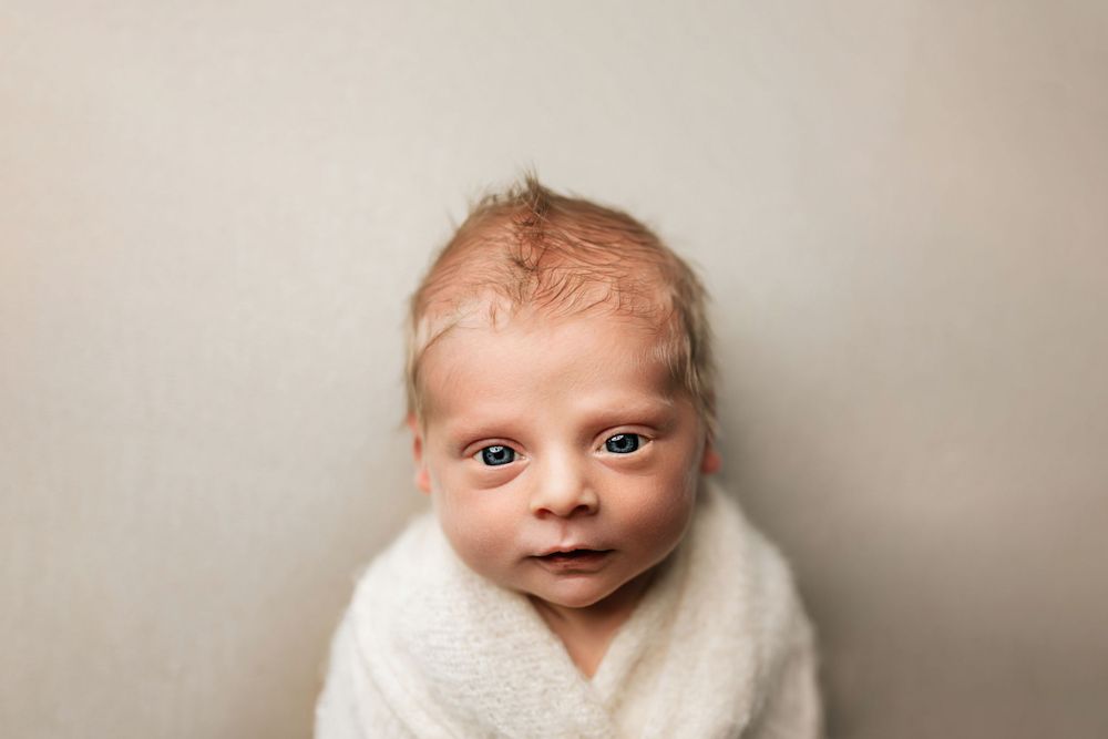 Newborn boy eyes open photography studio Bluffton Fort Wayne Indiana