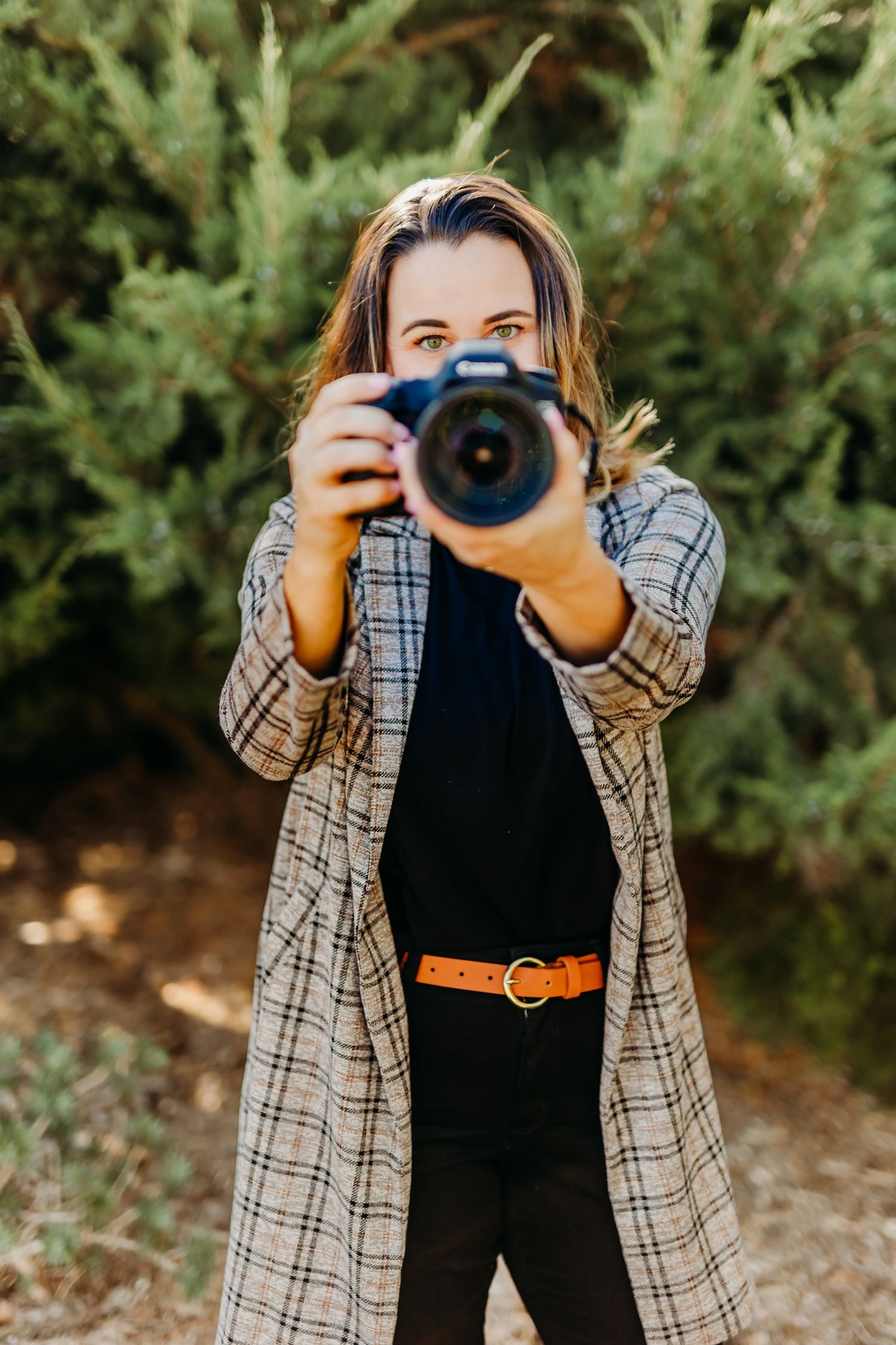 San Diego Photographer, Alyssa DeGraff points her lens towards the camera during a personal branding shoot in Escondido