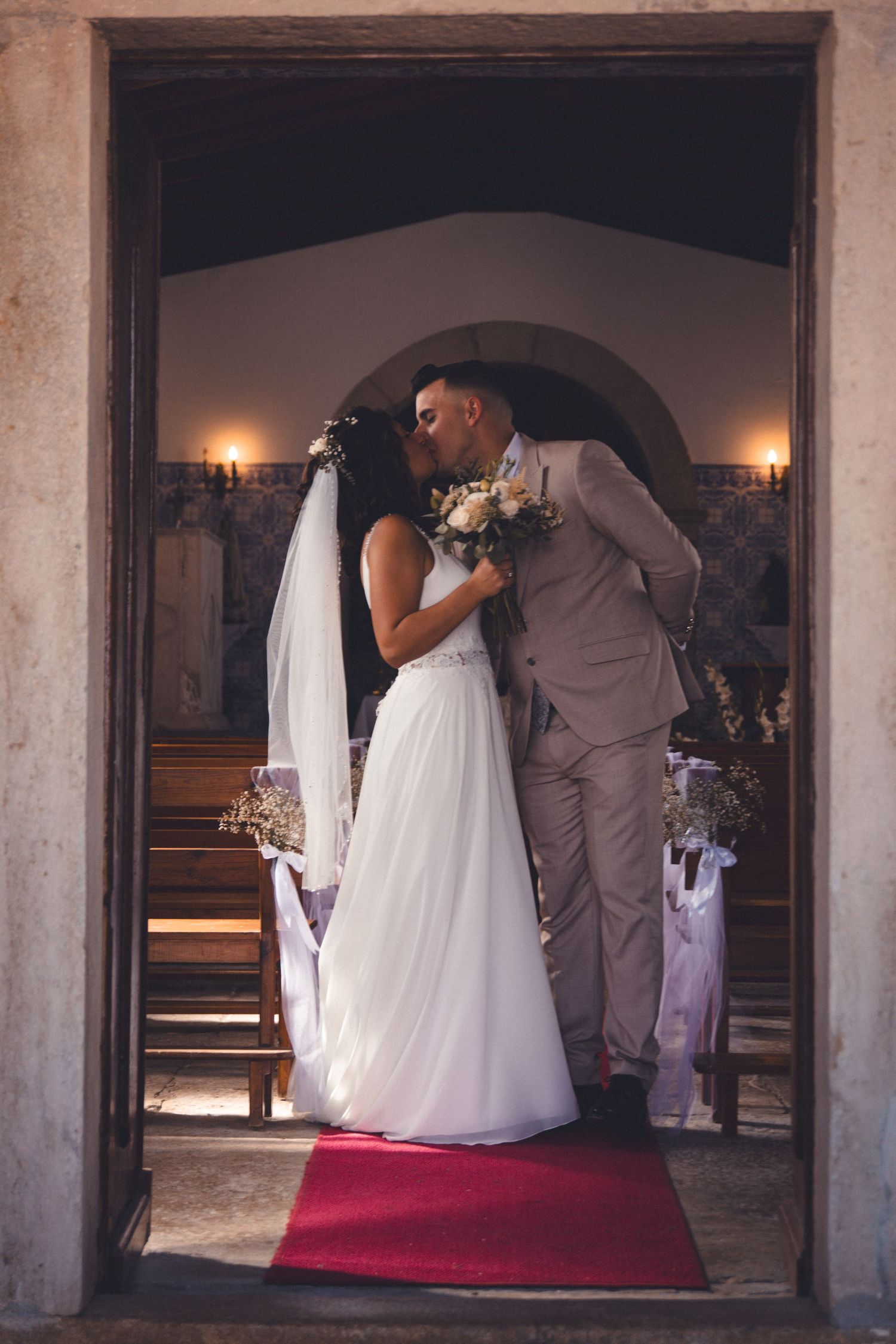 Elegant wedding ceremony sequence showing couple in traditional attire at church altar with stone archways.