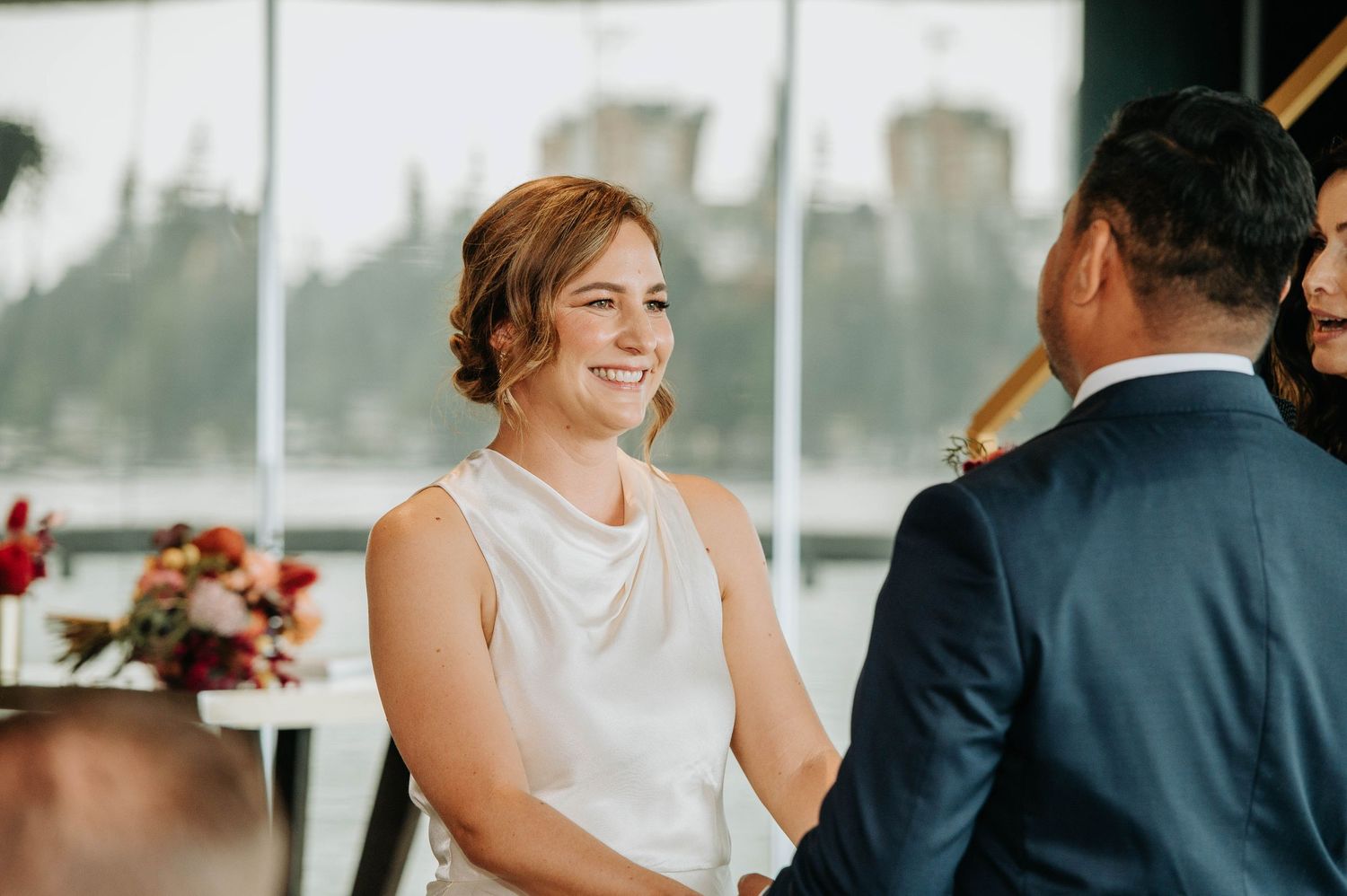 A couple shares a joyful moment during their wedding ceremony.