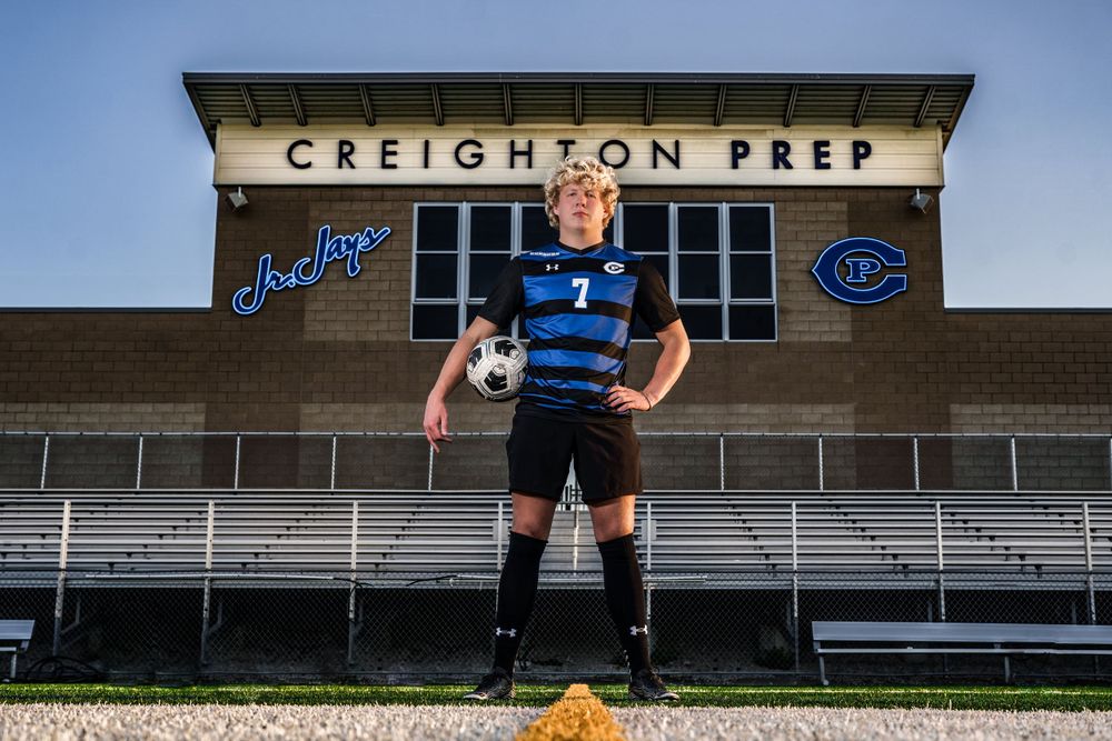 soccer player poses in stadium