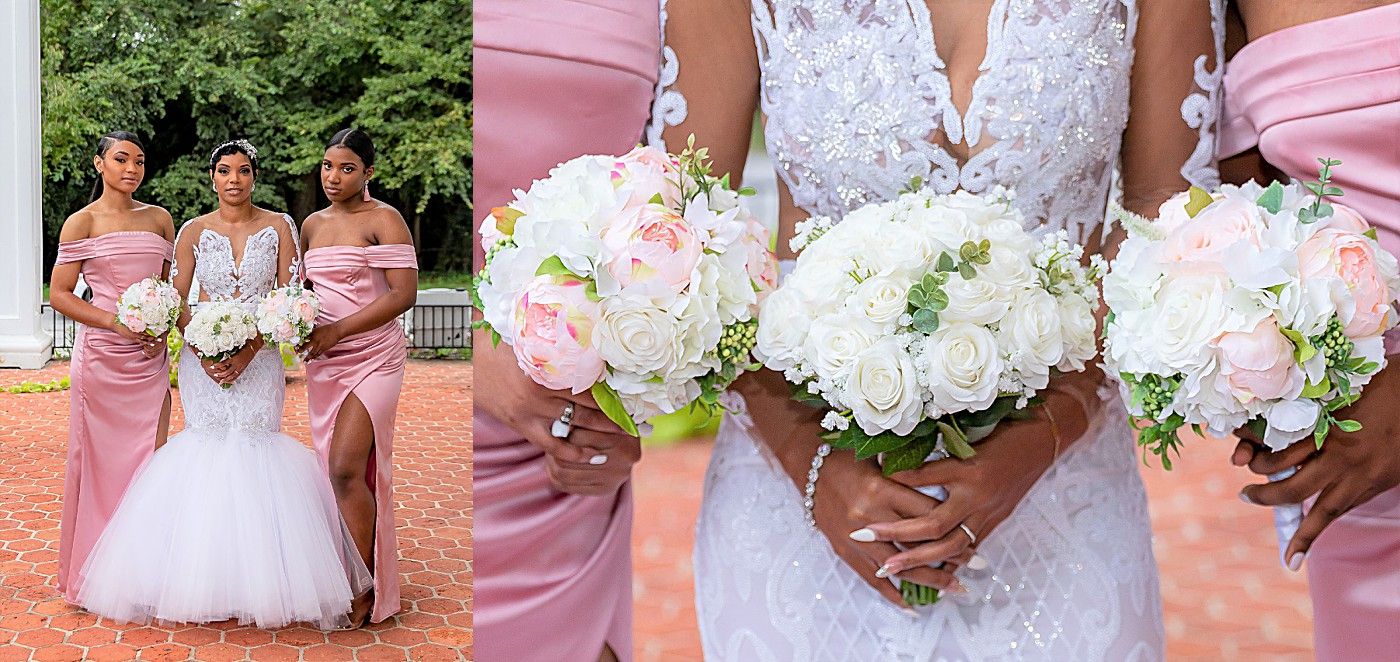 Bridesmaids in pink satin dresses and bride in lace gown display elegant white and blush rose bouquets outdoors.