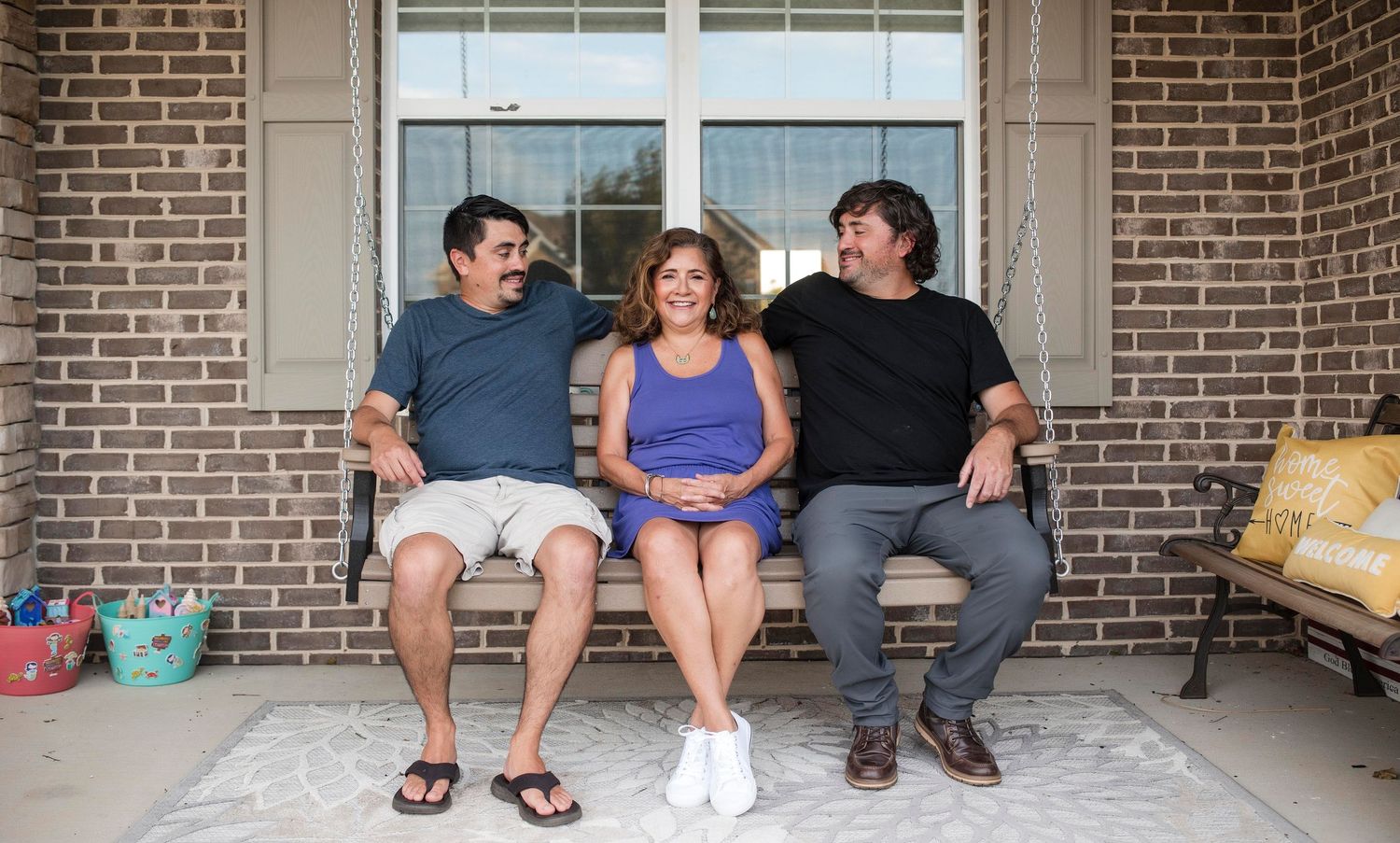 Mom and sons family portrait on porch