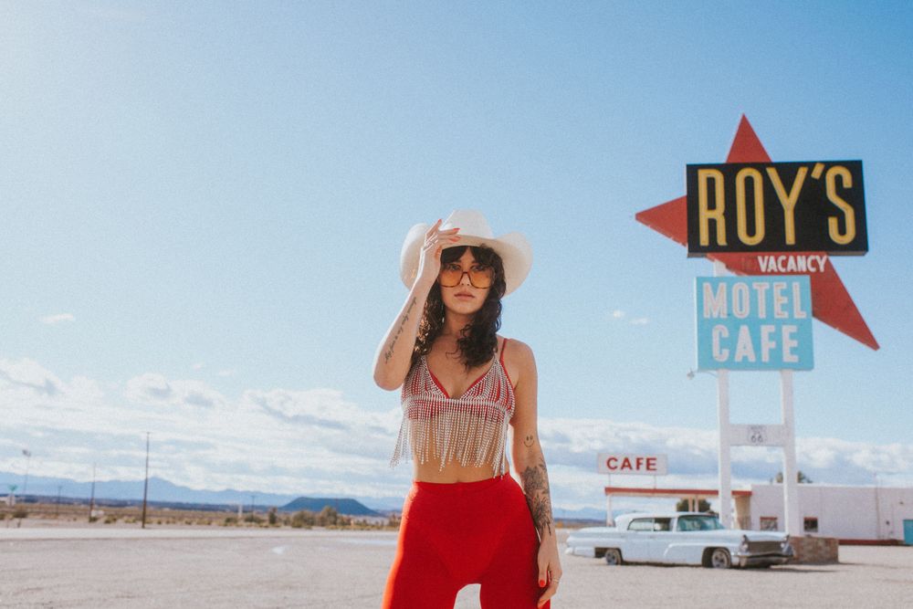 JJ Wilde outside Roy's Gas Station in Amboy, California