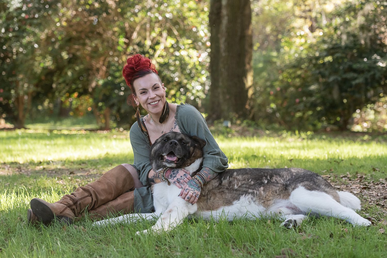 Woman poses with Akita dog at Charlestowne Landing in Charleston, SC. Photographed by SC dog photographer.