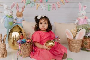 Easter themed setup with bunny decorations and pink party decor.