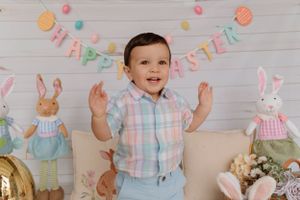 Festive Easter scene with pastel banner, bunny decorations and spring decor.