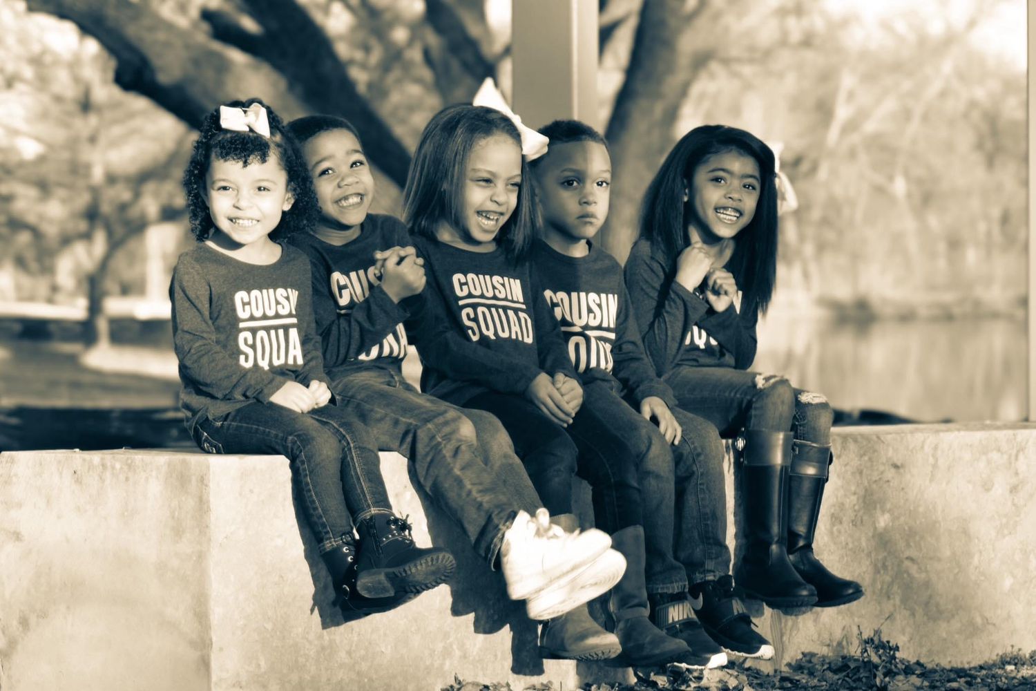 Outdoor group portrait of children smiling together during a family photography session