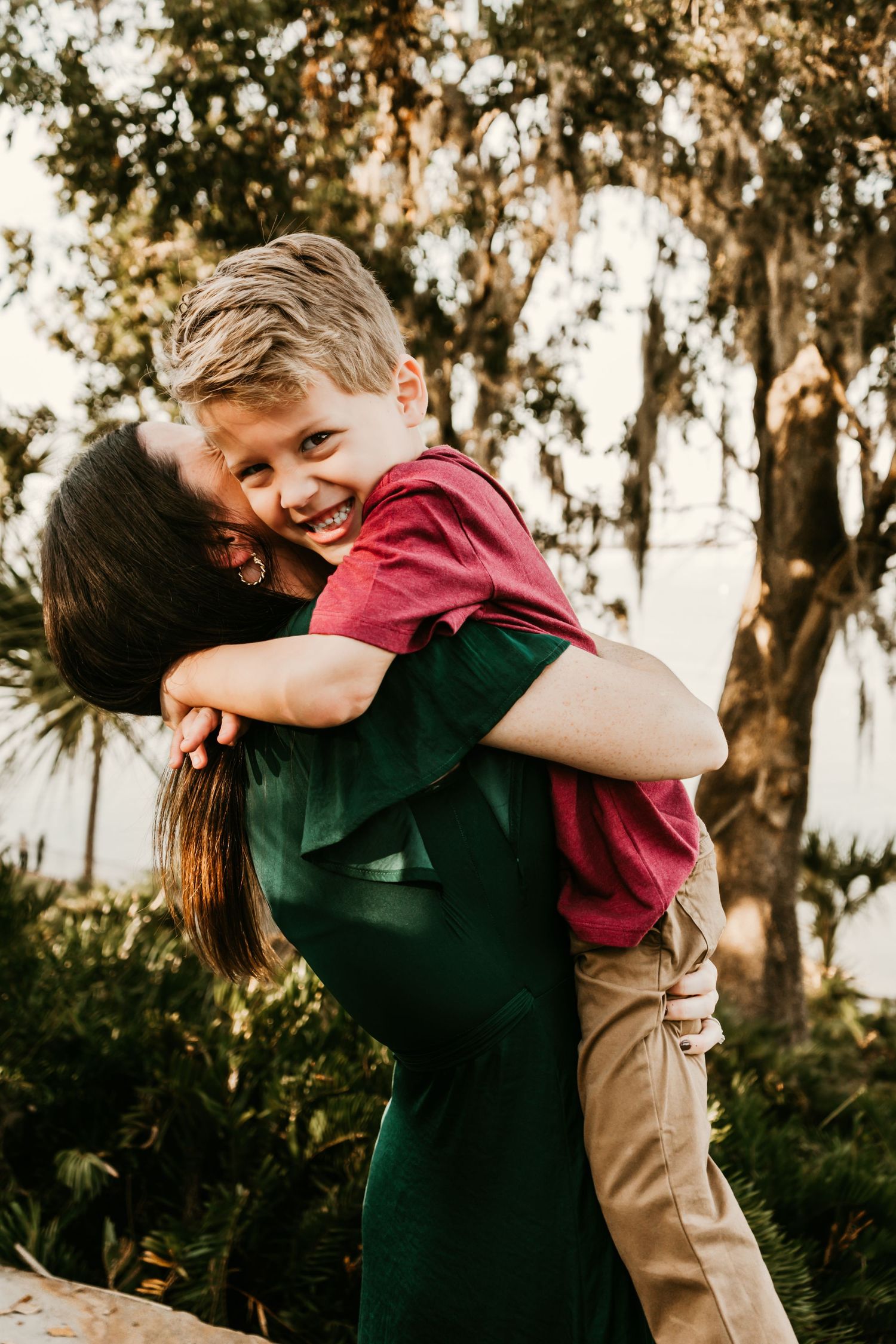 Outdoor Family Session Philippe Park in Safety Harbor, FL; Mom and son embracing
