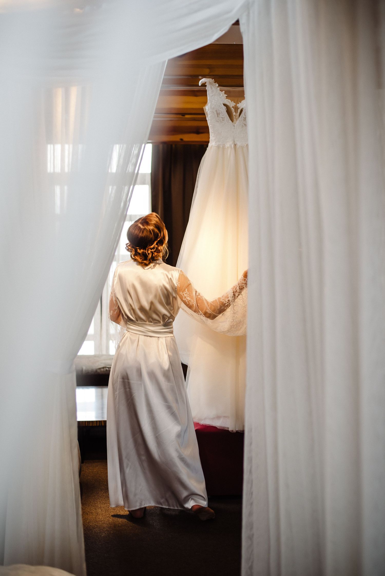 Bride looking at her wedding dress