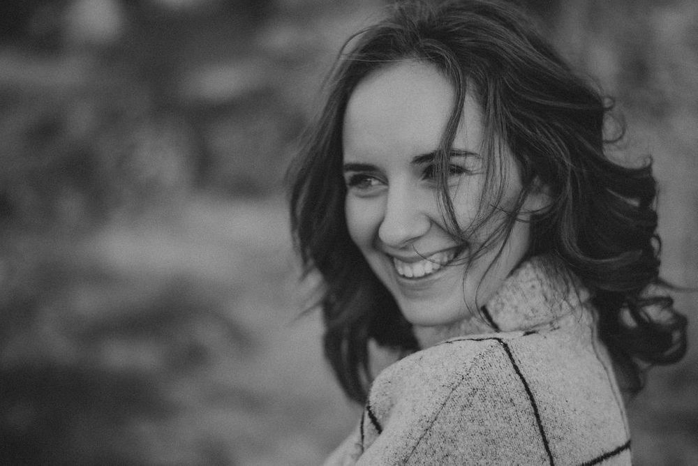 Joyful outdoor photography featuring casual poses and natural expressions.