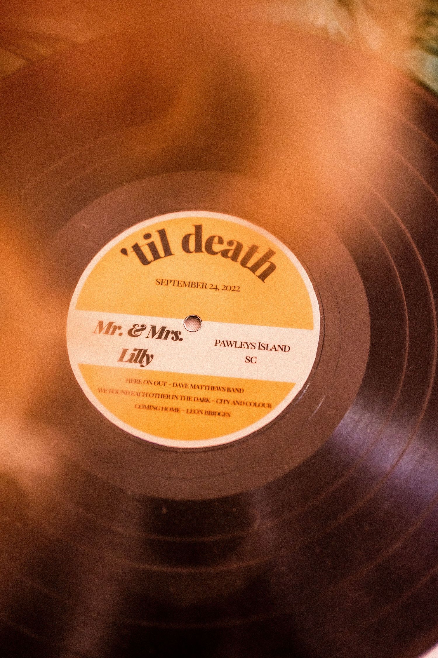 Close-up of vintage vinyl record labels in warm sepia tones.