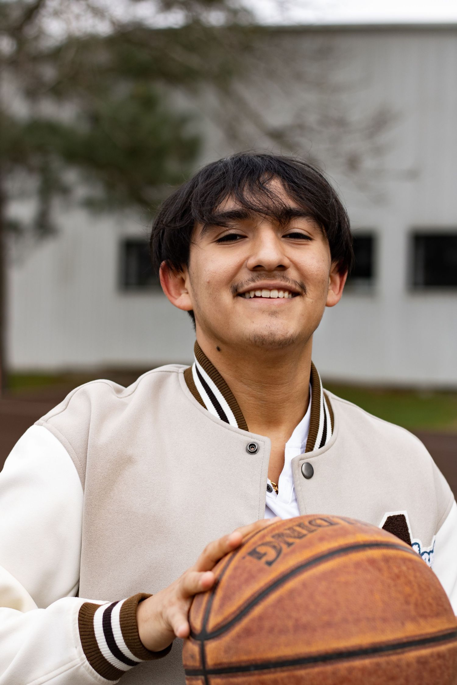A series of casual portraits with a basketball against a light background.
