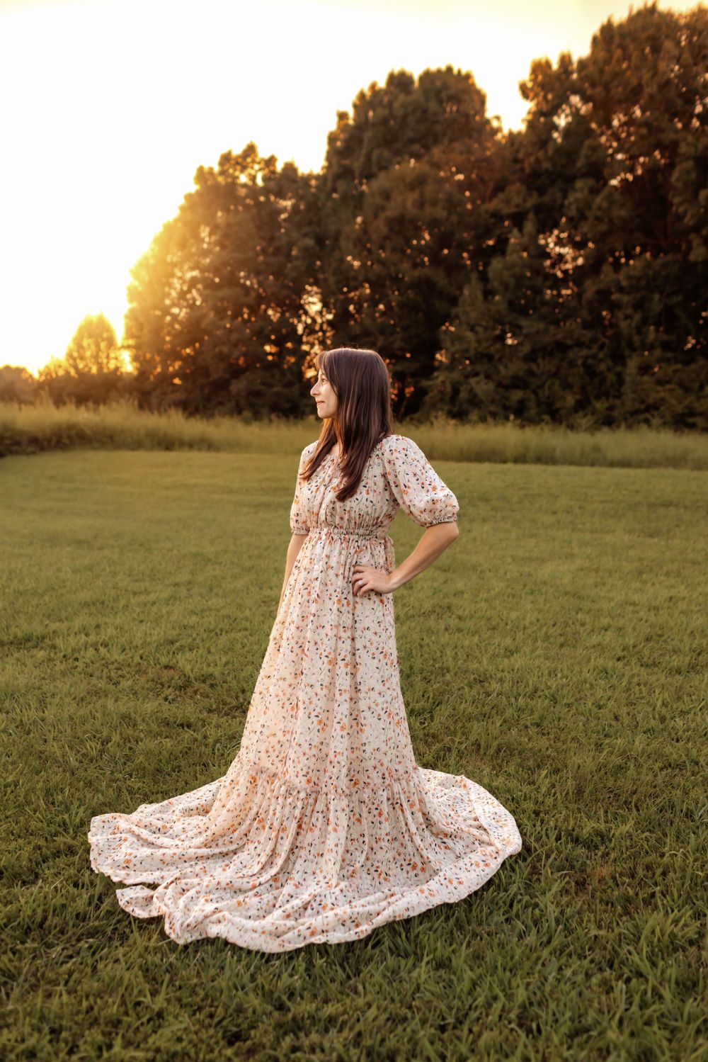 Expecting mother in neutral dress during maternity photoshoot in Mooresville NC