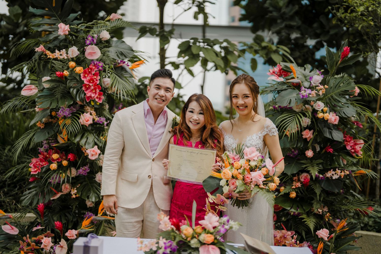 Outdoor wedding reception with tropical flowers and beige color scheme.