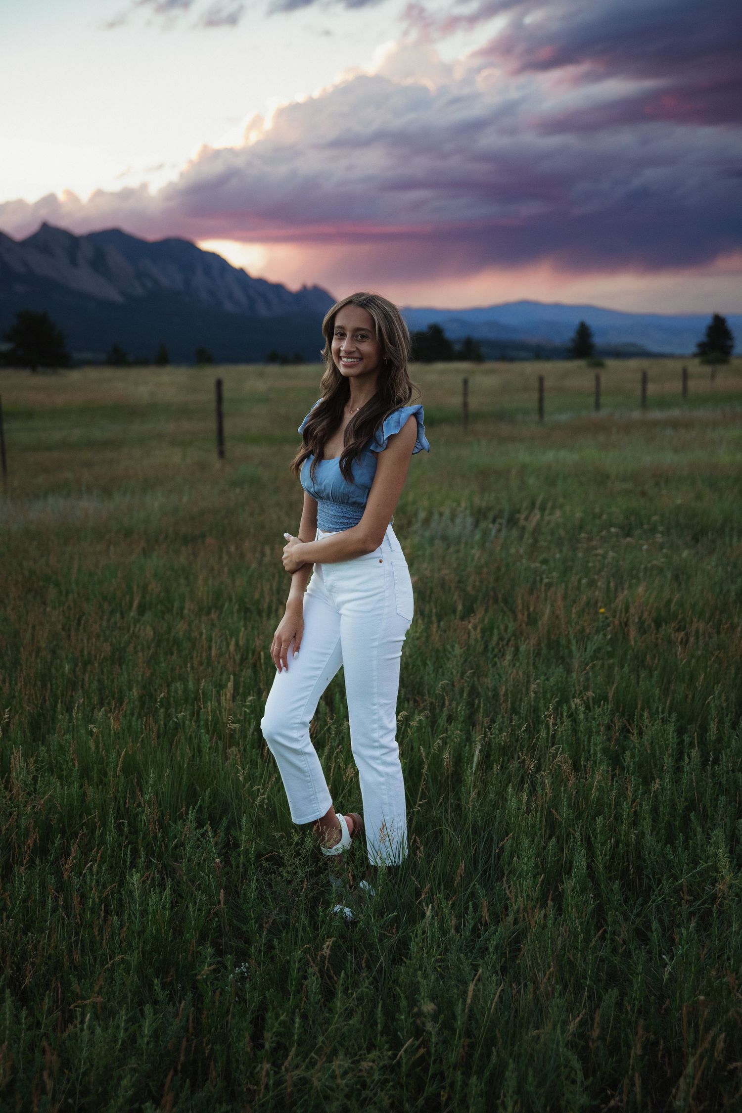 Sara Prue Photography captures the spirit of youth in this stunning high school senior portrait at Flatirons Trailhead Vista