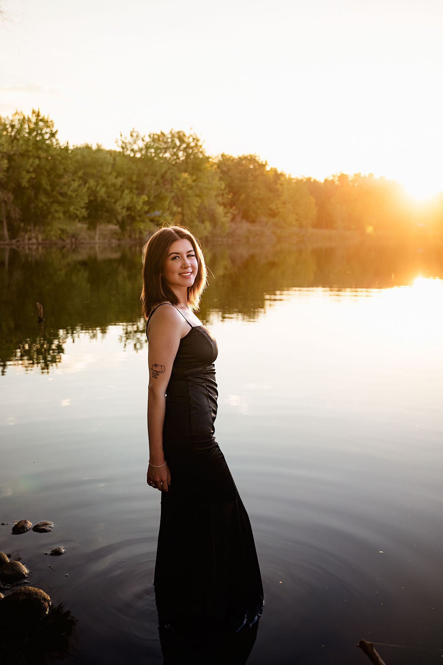 Capturing a senior's milestone in the beauty of Longmont: A portrait session at Golden Ponds.