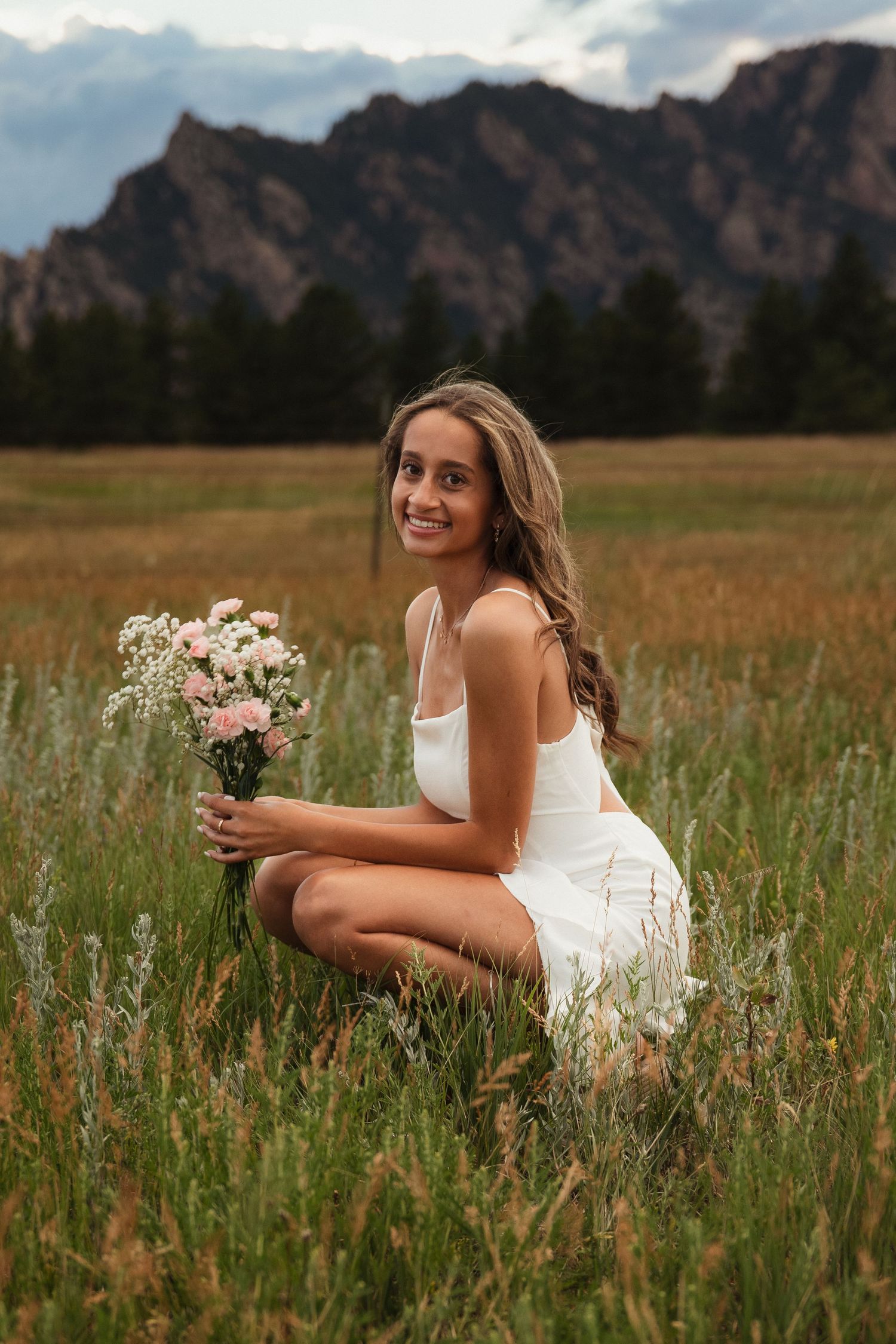 Sara Prue Photography captures the spirit of youth in this stunning high school senior portrait at Flatirons Trailhead Vista