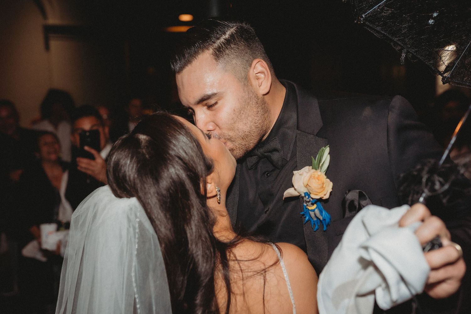 Intimate wedding moment captured during evening reception celebration.