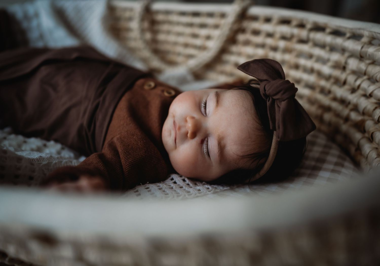 Artistic close-up portrait photography with moody lighting and textured background.