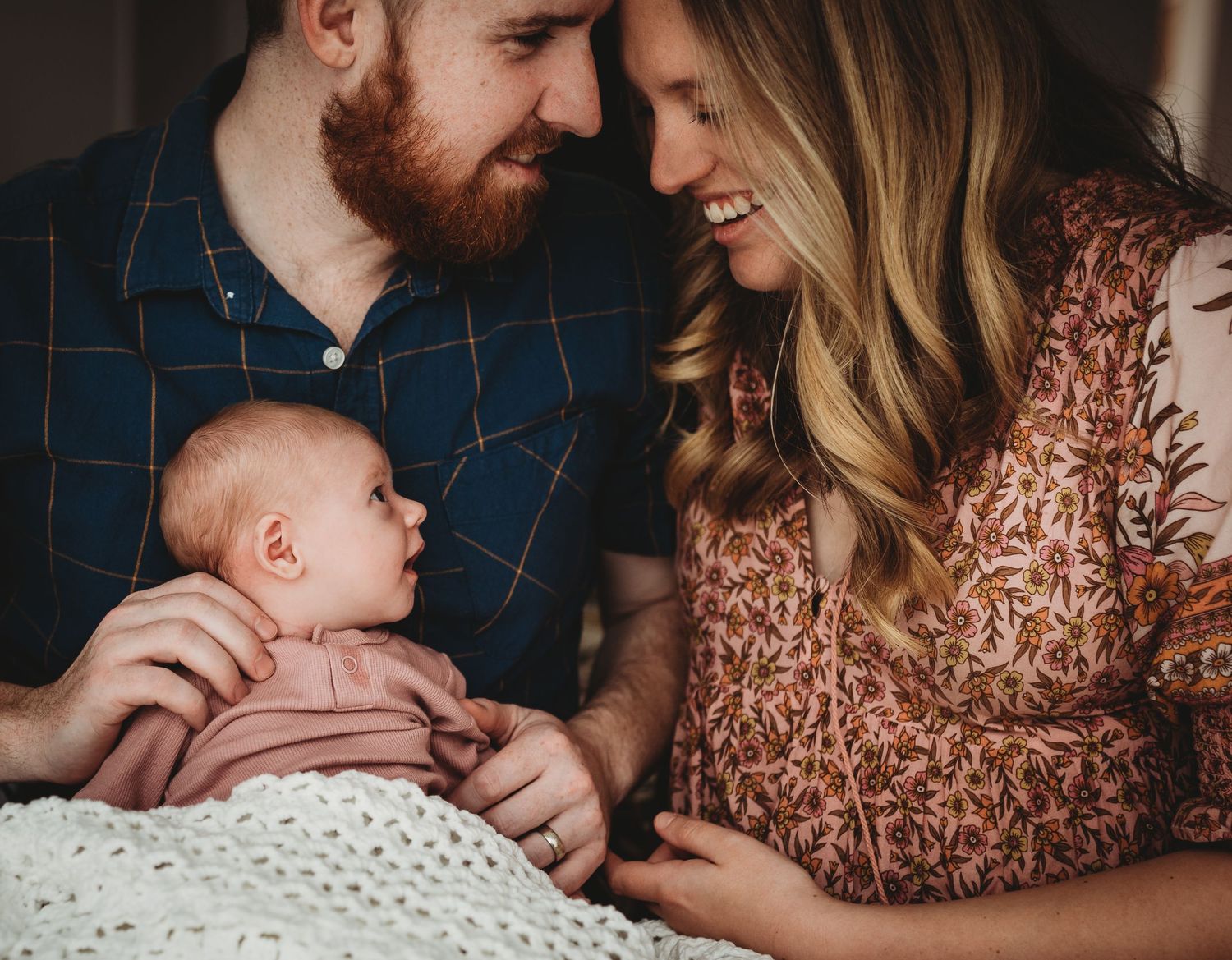 Tender family moments captured in series of intimate indoor photographs.